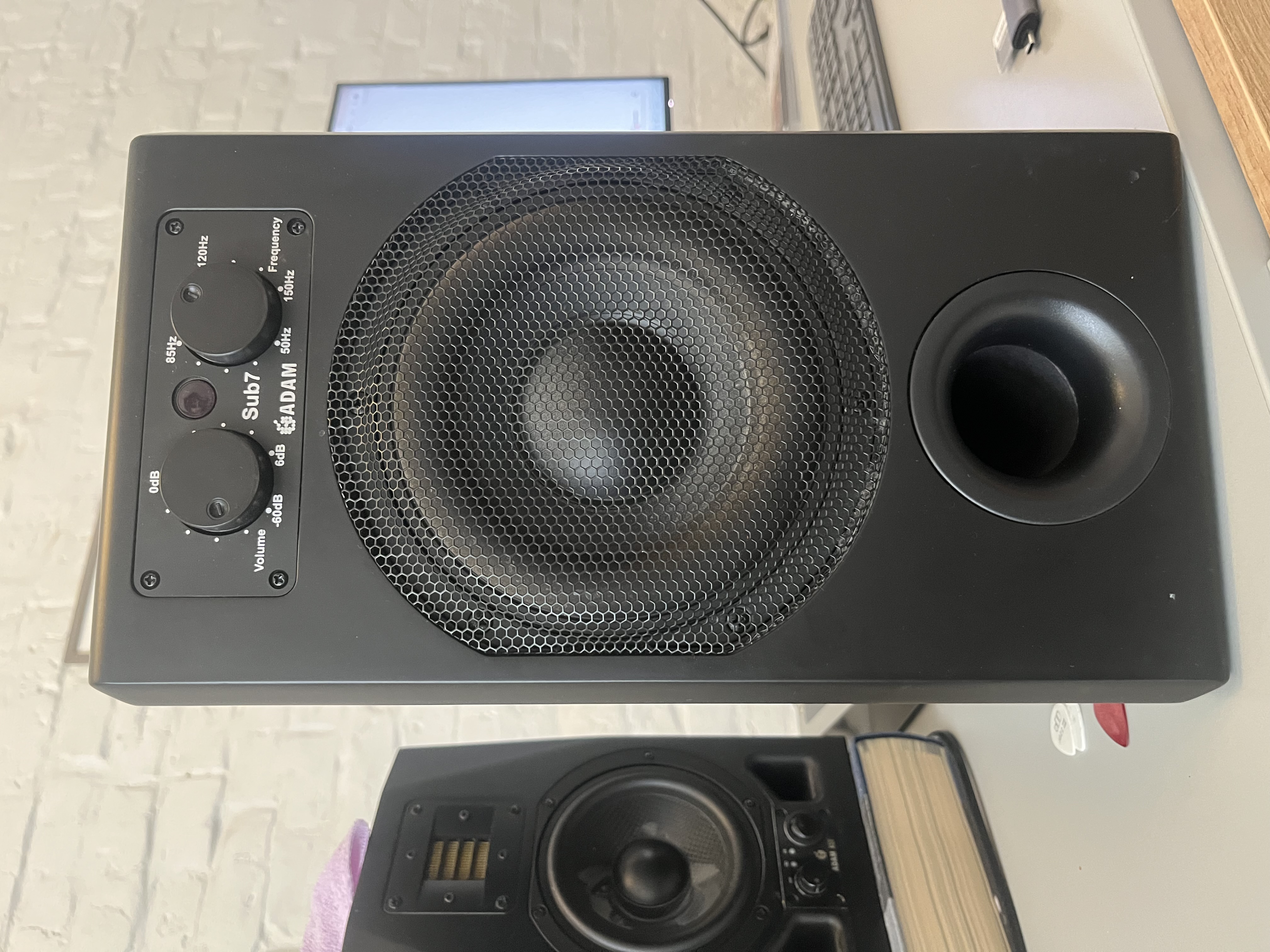 ADAM Sub7 subwoofer beside a compact ADAM nearfield monitor in Mike's home studio.