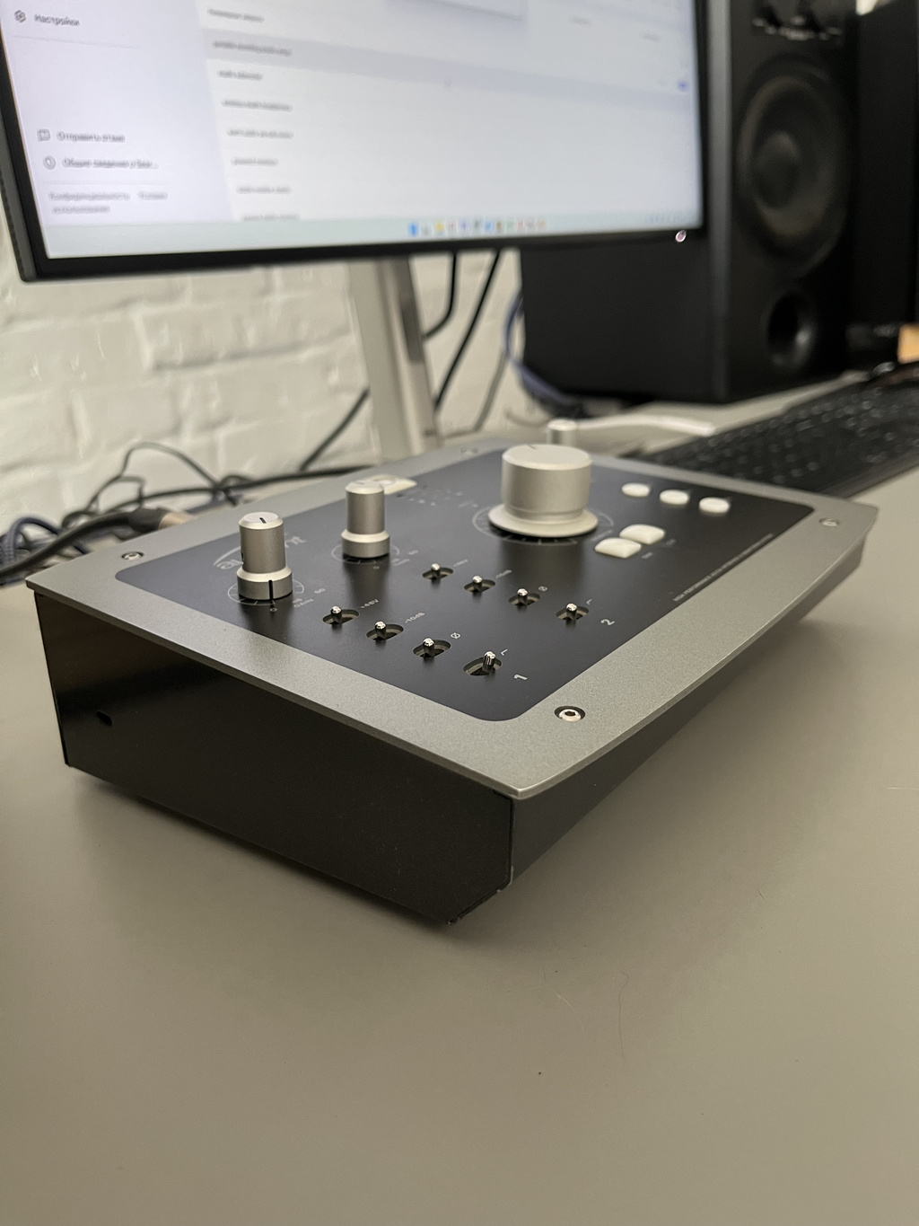 Audient iD22 audio interface in a compact home music studio workspace